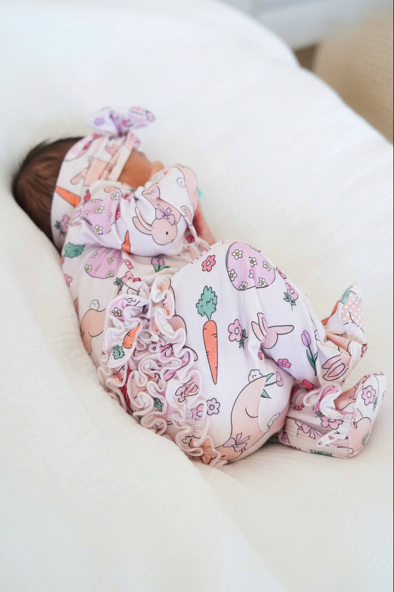 closeup of pink easter ruffle zipper footie for baby girls 