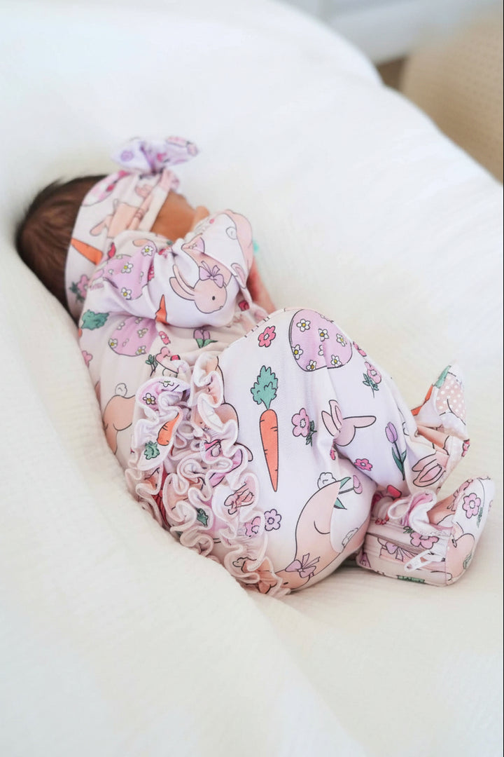 closeup of pink easter ruffle zipper footie for baby girls 