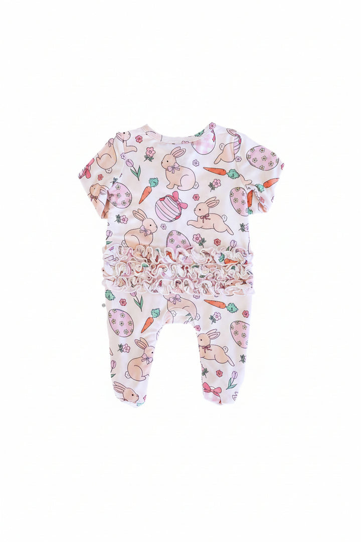 pink ruffle bottom zipper footie for baby girls with bunnies, easter eggs, carrots and flowers 