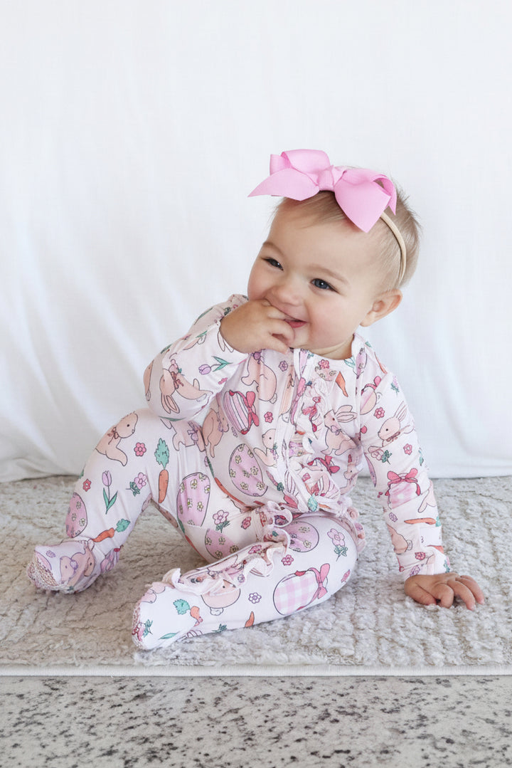 hoppy spring pink easter footie for girls with matching pink ribbon bow headband 