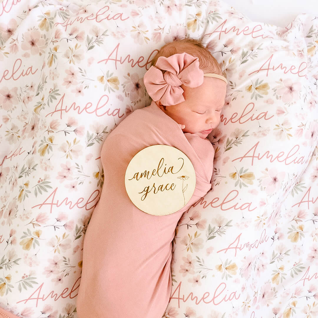 script font with flower baby name wood announcement 