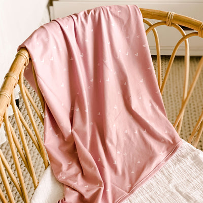 pink swaddle blanket with small hearts 