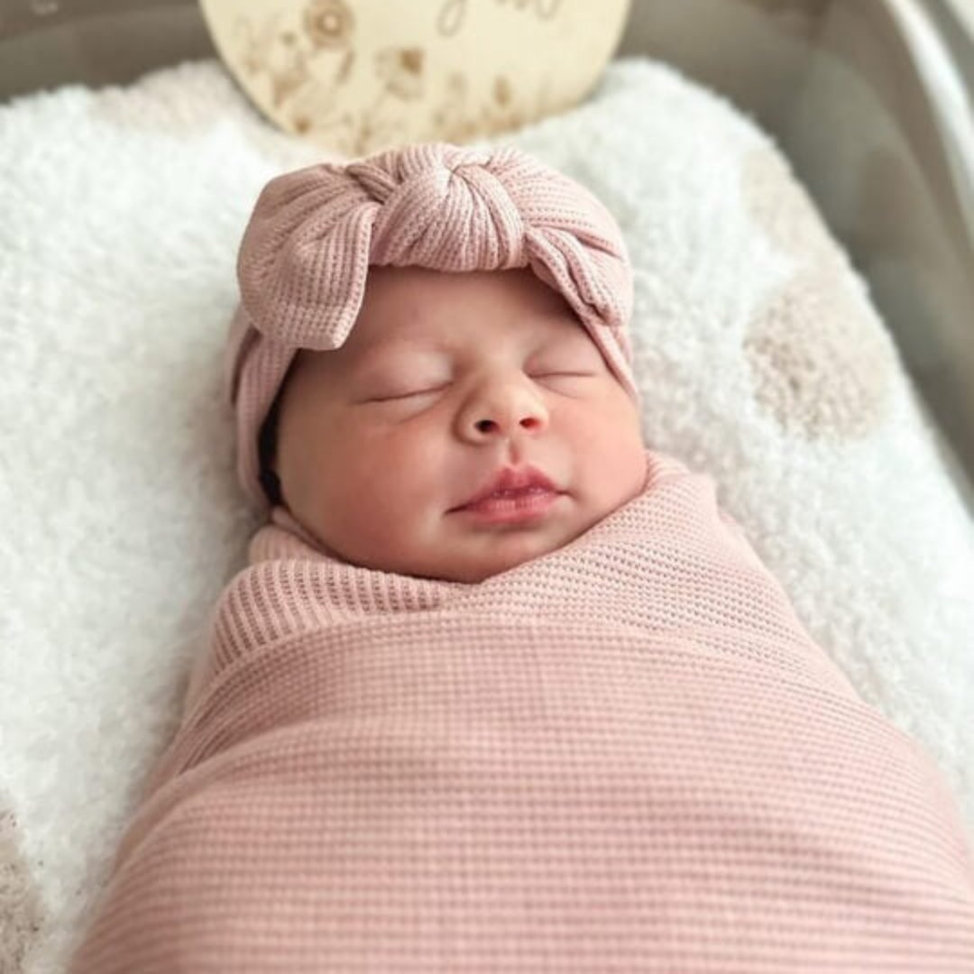 baby wearing the lovely pink hearwrap