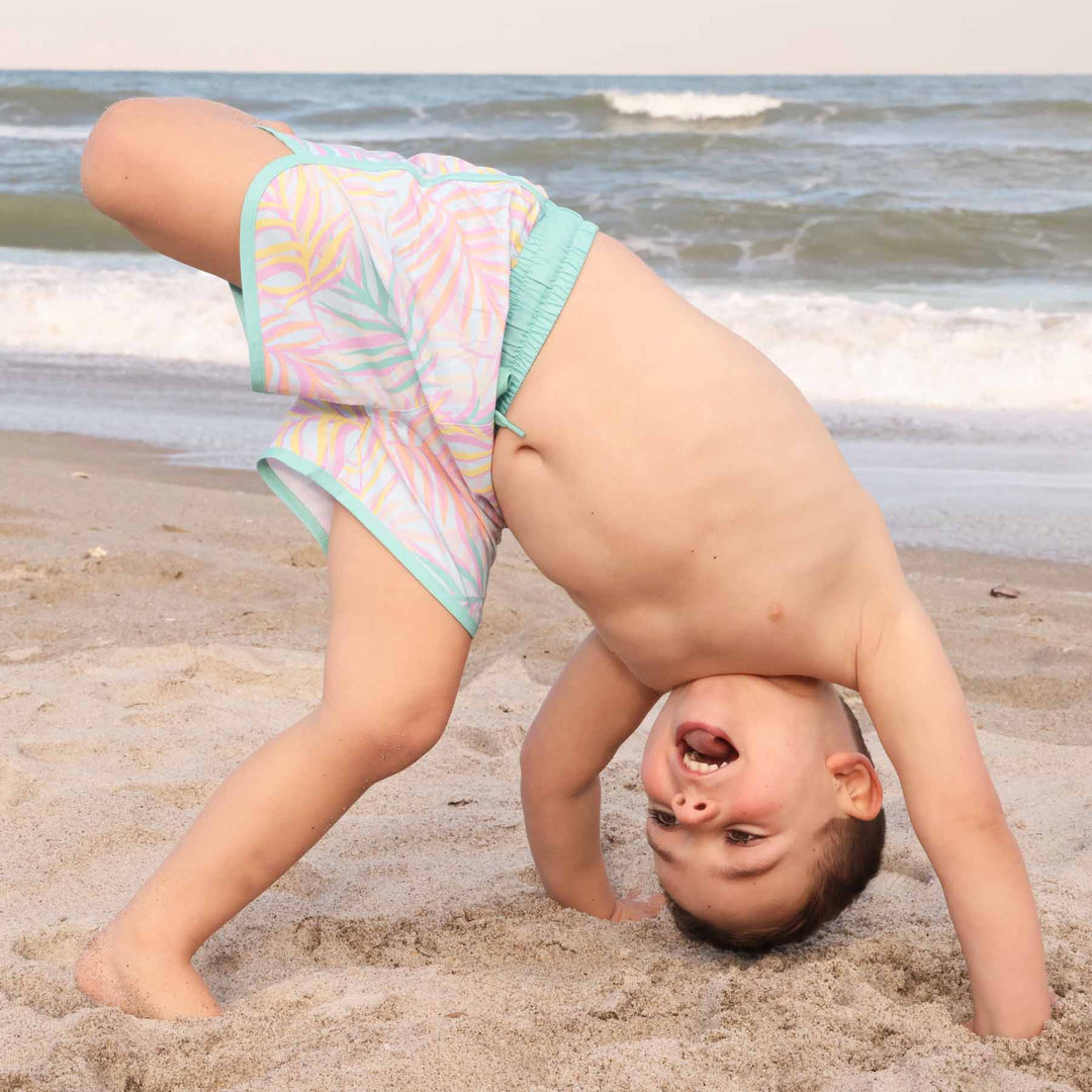 boys' swim trunks in pastel palm leaves with mint green detailing - caden lane
