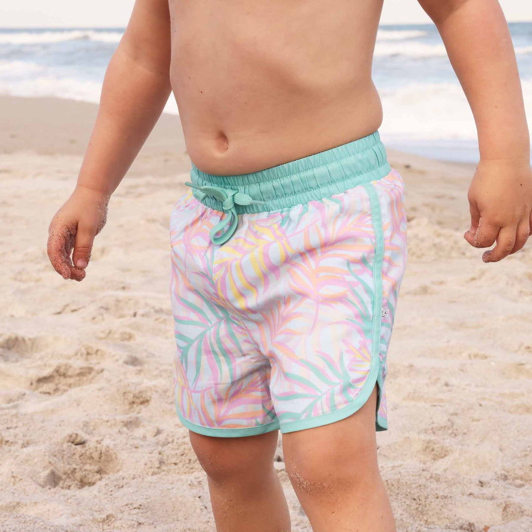 boys' swim trunks with pastel palm leaves and mint green detail - ideal for beach days - caden lane