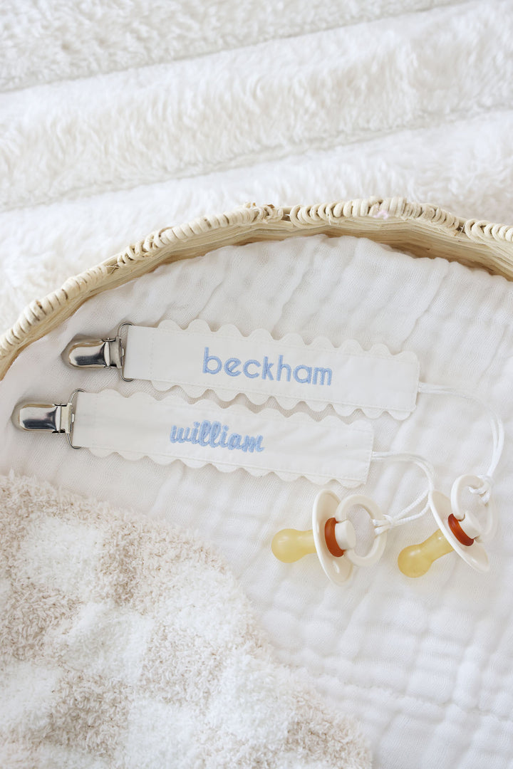 white ric rac pacifier clip with blue thread 
