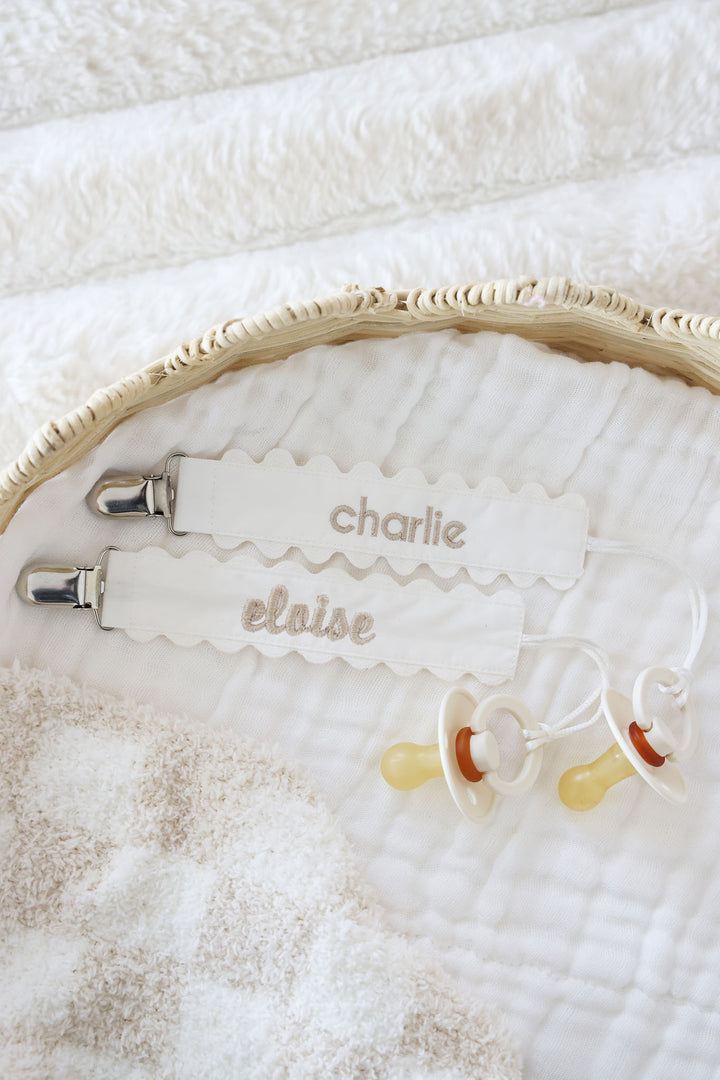 white ric rac pacifier clip with tan thread 