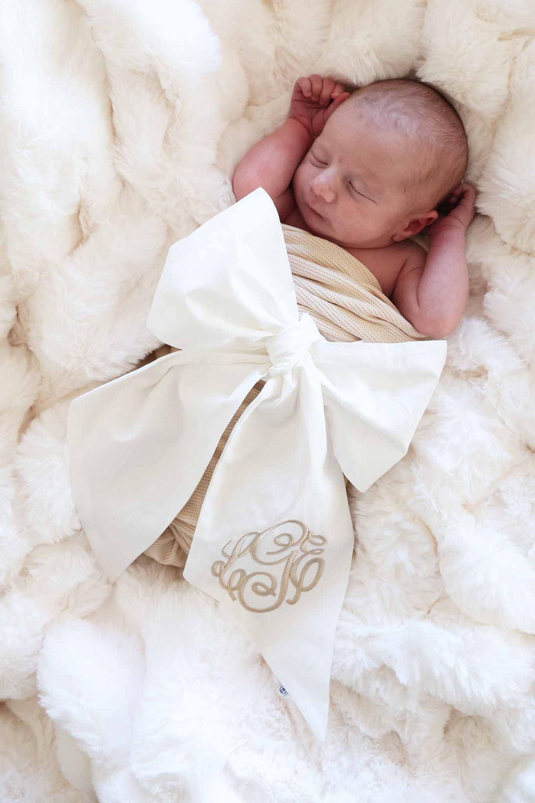 monogrammed ivory bow sash for babies gender neutral 