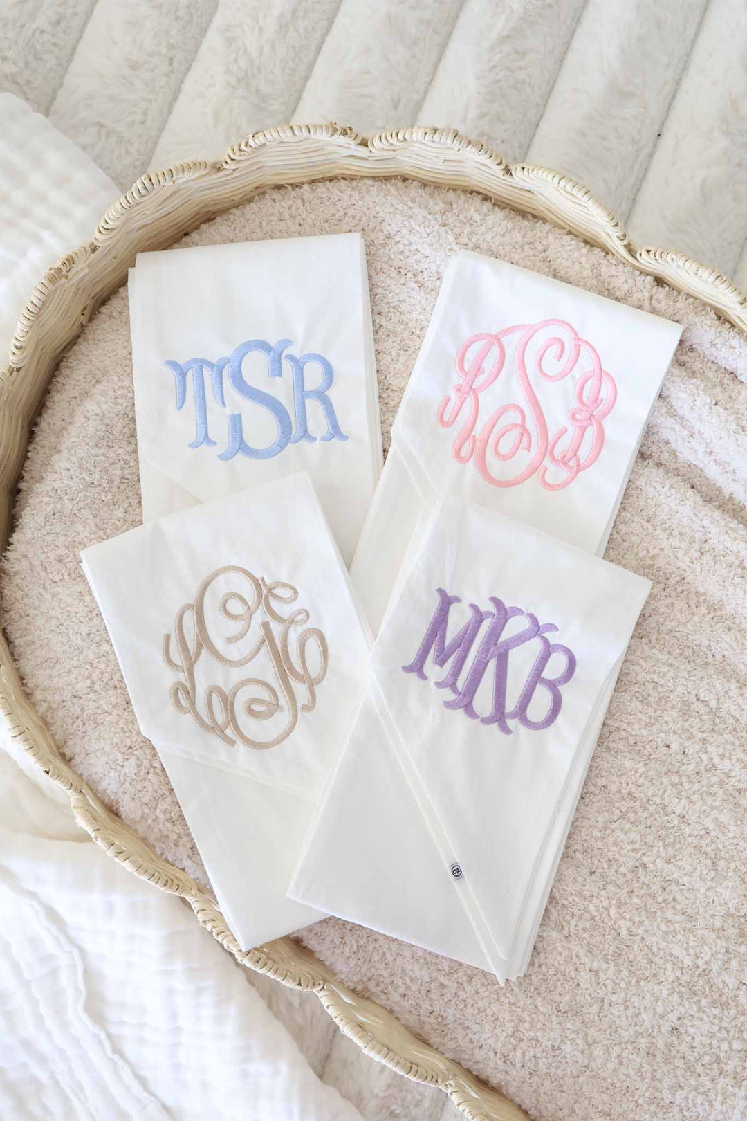 ivory sashes with monogram in coloful font 