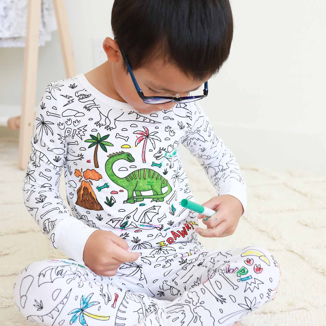 boy wearing Jurassic Playground Colorable Pajama Two Piece Set