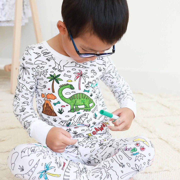boy wearing Jurassic Playground Colorable Pajama Two Piece Set