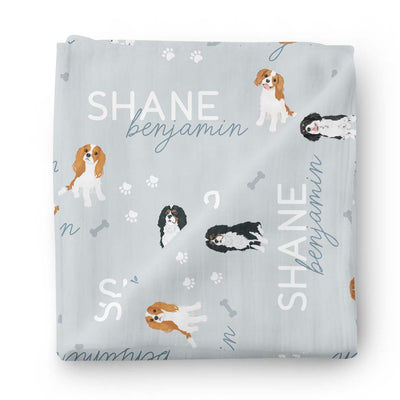 blue personalized baby name swaddle blanket with king charles dog