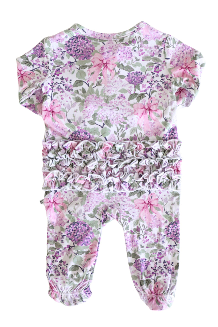 back view of lavender lullaby ruffle zipper footie pajama 