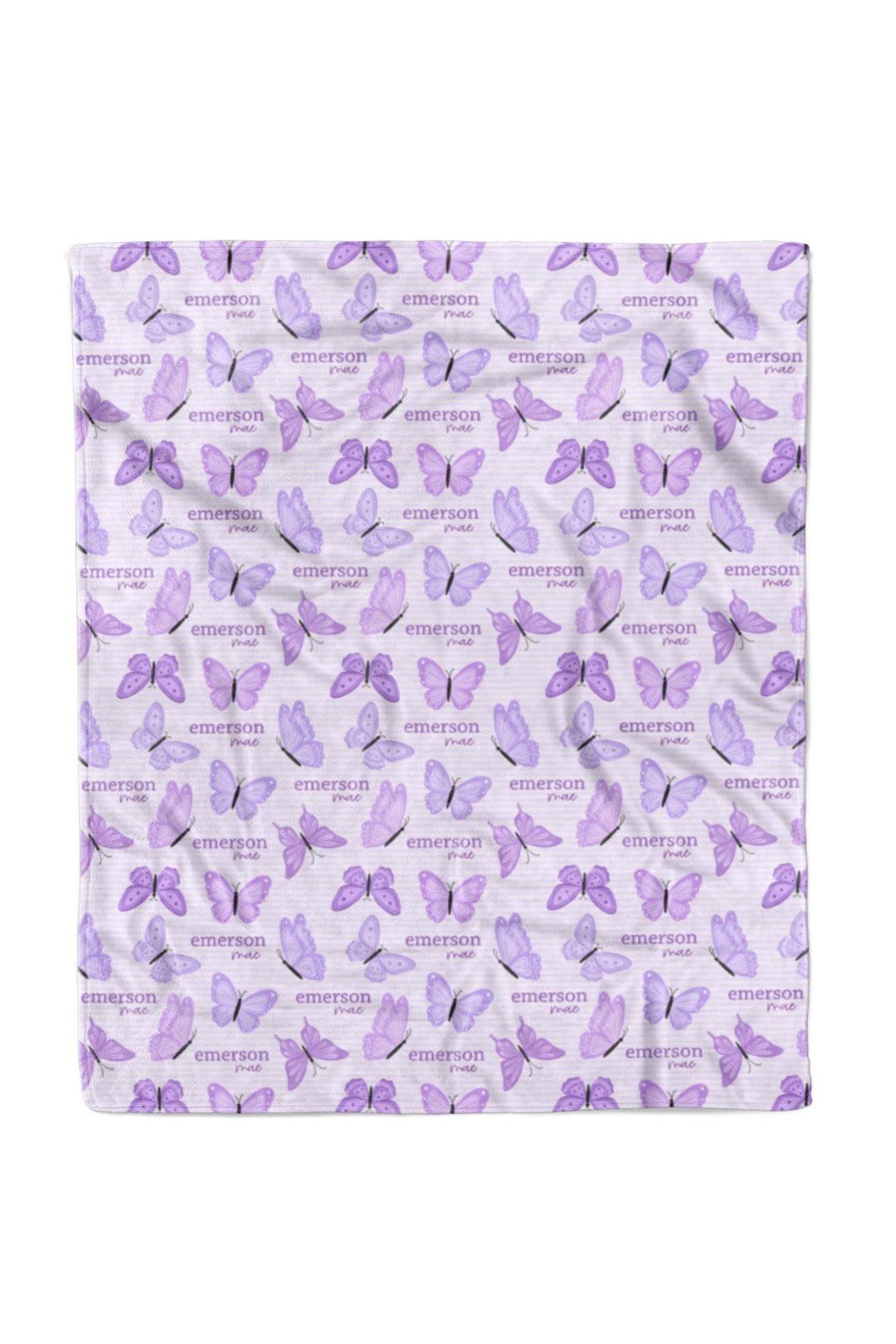 Flat lay of a fully unfolded personalized Caden Lane Lavender Wings blanket in lavender striped fabric, showing the full repeating pattern of purple butterflies and custom name
