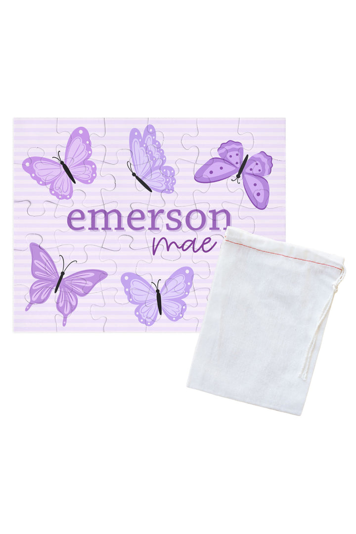 Personalized Caden Lane Lavender Wings jigsaw puzzle in lavender stripes, showing butterflies and custom name, paired with a white drawstring storage bag