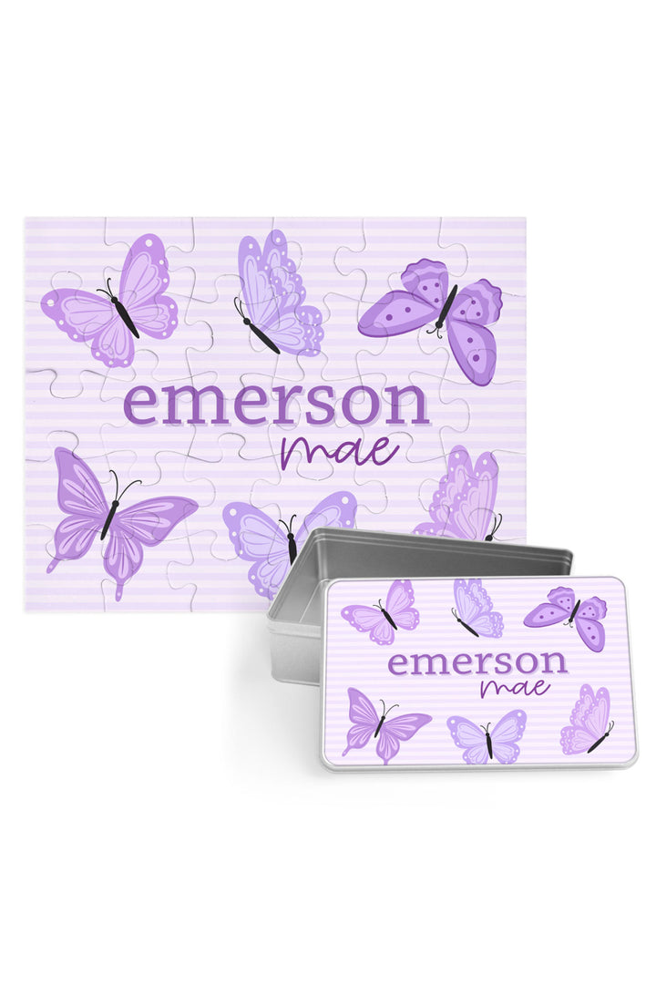Personalized Caden Lane Lavender Wings jigsaw puzzle in lavender stripes, showing butterflies and custom name, paired with a matching silver storage tin