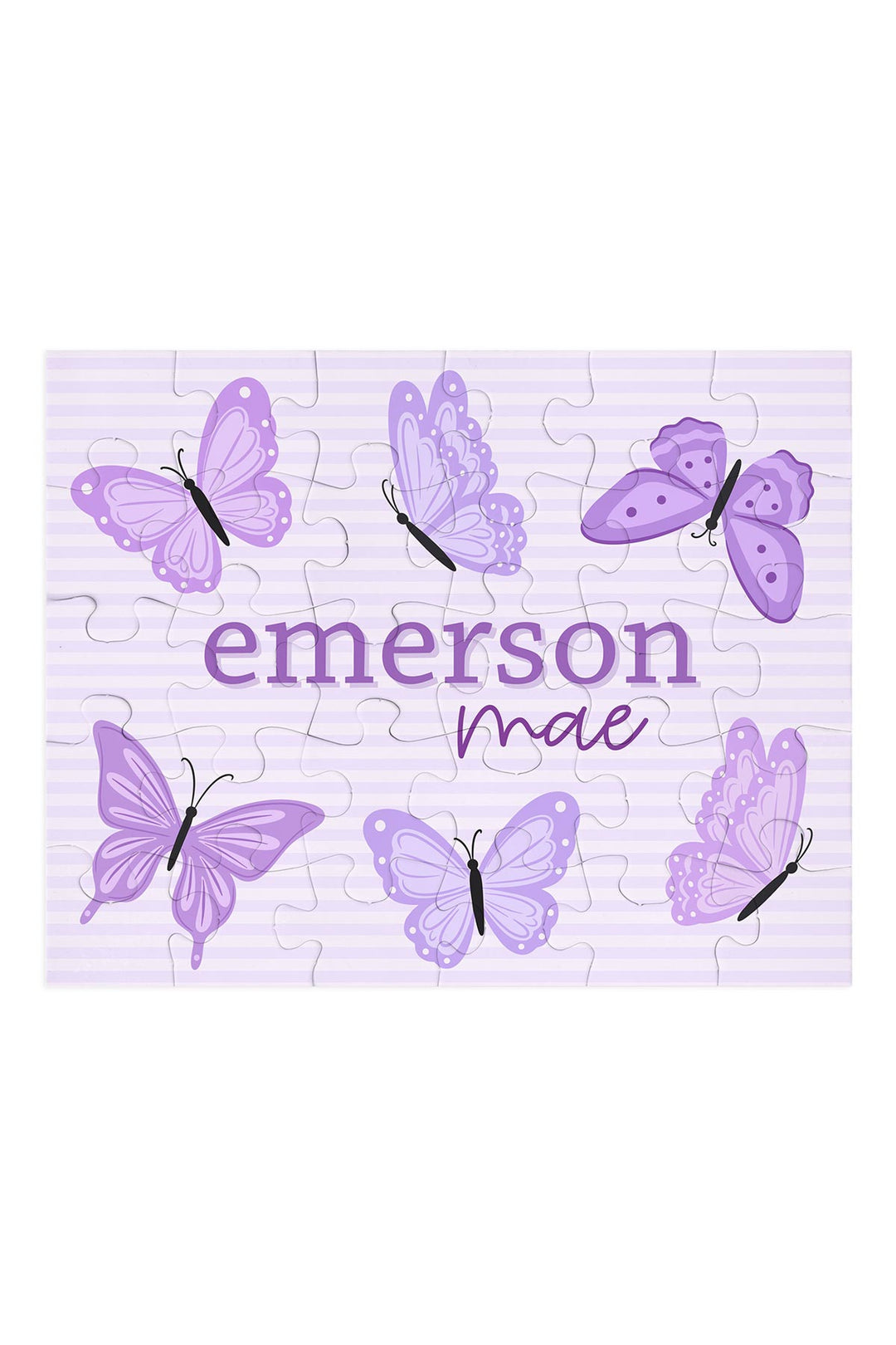 Flat lay of an assembled personalized Caden Lane Lavender Wings jigsaw puzzle in lavender stripes, showing butterflies and custom name