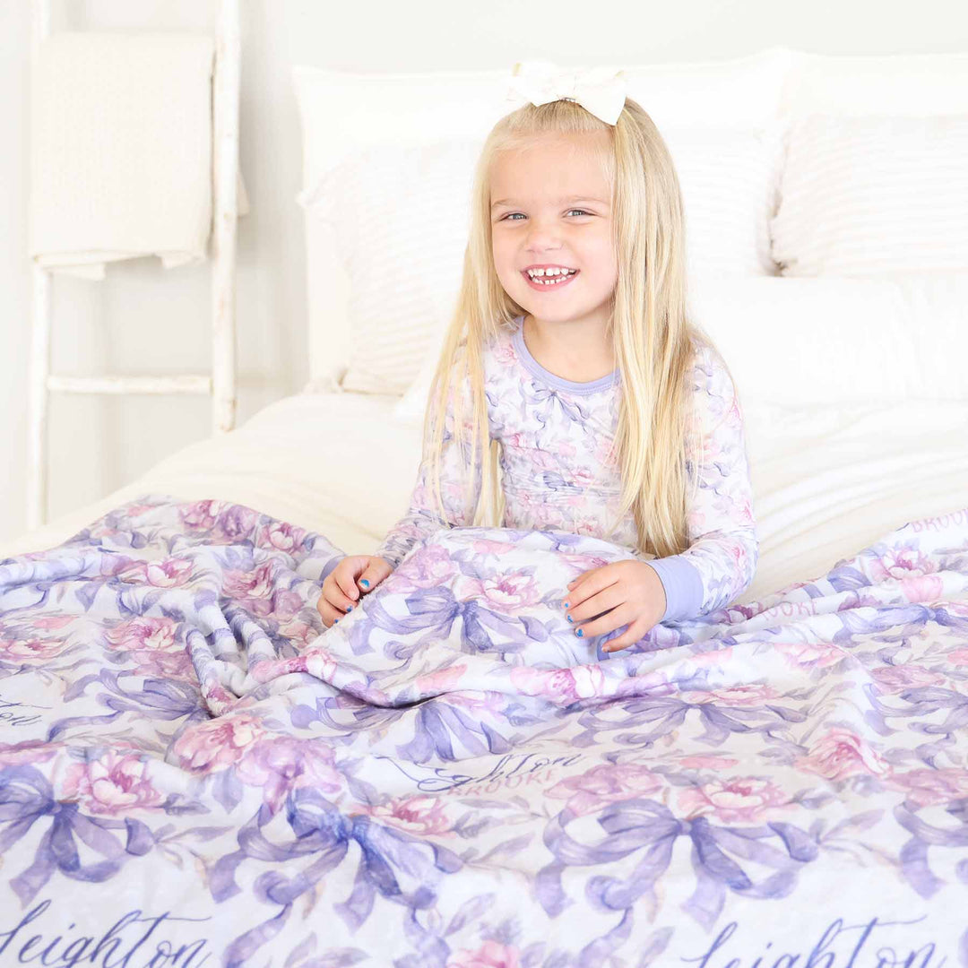 girls personalized blanket with pink flowers and purple bows 