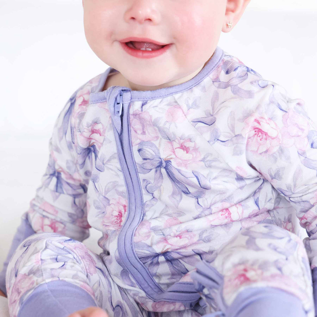 pink and purple floral and bow convertible zip romper pajama for babies and toddlers 