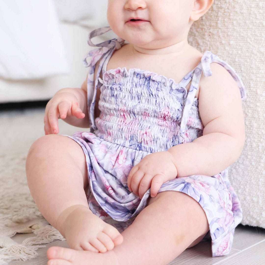 pink rose and purple bow smocked bow shoulder snap bottom bodysuit for babies and toddlers 