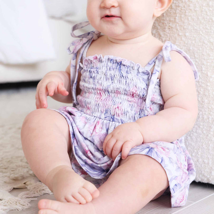 pink rose and purple bow smocked bow shoulder snap bottom bodysuit for babies and toddlers 