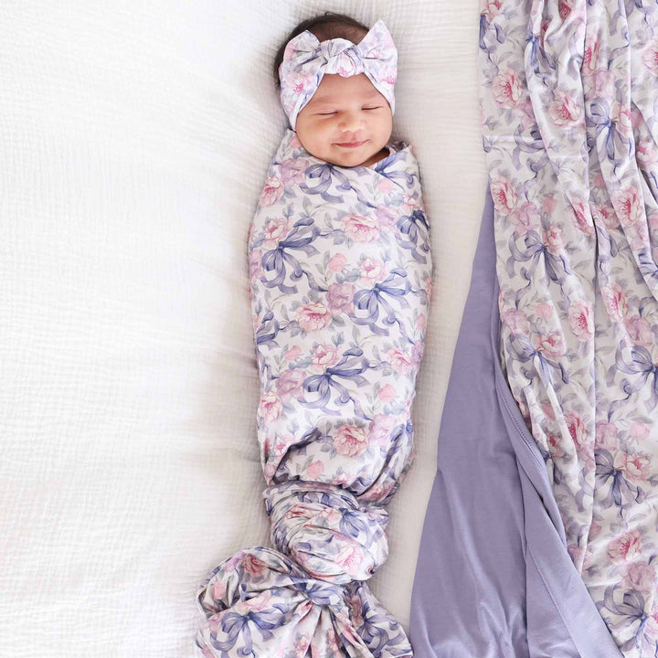 leighton's lavender pink and purple floral and bow oversized bamboo swaddle blanket for newborns 