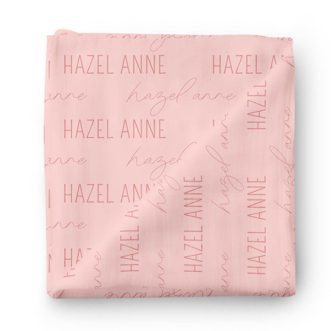 light rose on pink baby name swaddle blanket block and script font