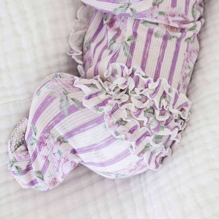 ruffle bottom zipper footie with purple stripes and roses 