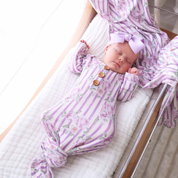 newborn knot gown with wooden buttons in lila's lilacs print 