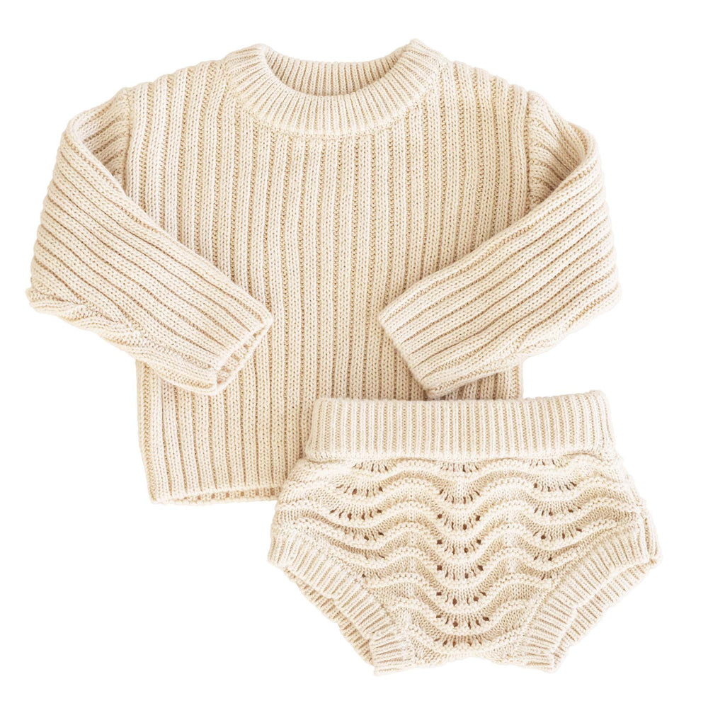 neutral sweater set for babies with lace bloomers 