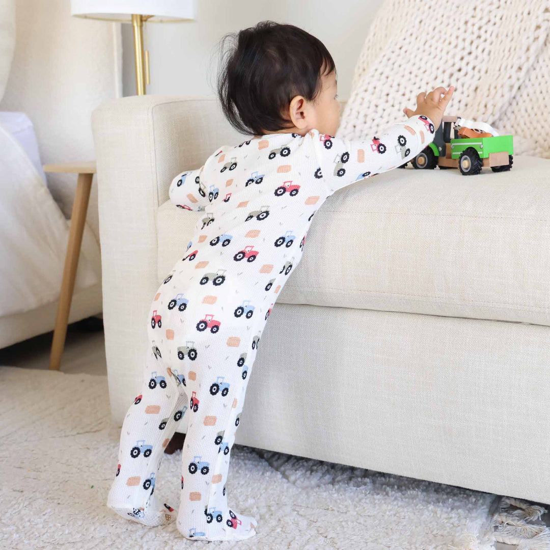 bamboo waffle zipper baby footie with tractors and hay bales 