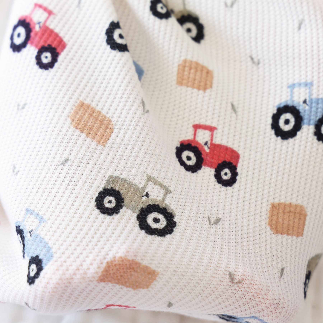 bamboo waffle knot gown with red, green and blue tractors and hay bales 