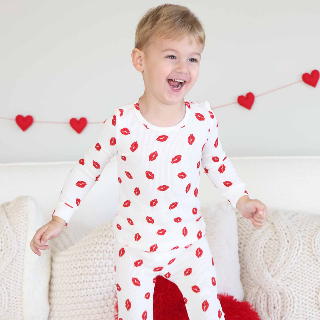 long sleeve and pant bamboo waffle two piece pajama set for kids with red lipstick kisses on it