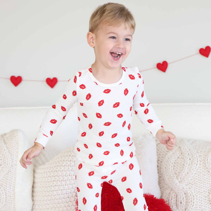long sleeve and pant bamboo waffle two piece pajama set for kids with red lipstick kisses on it