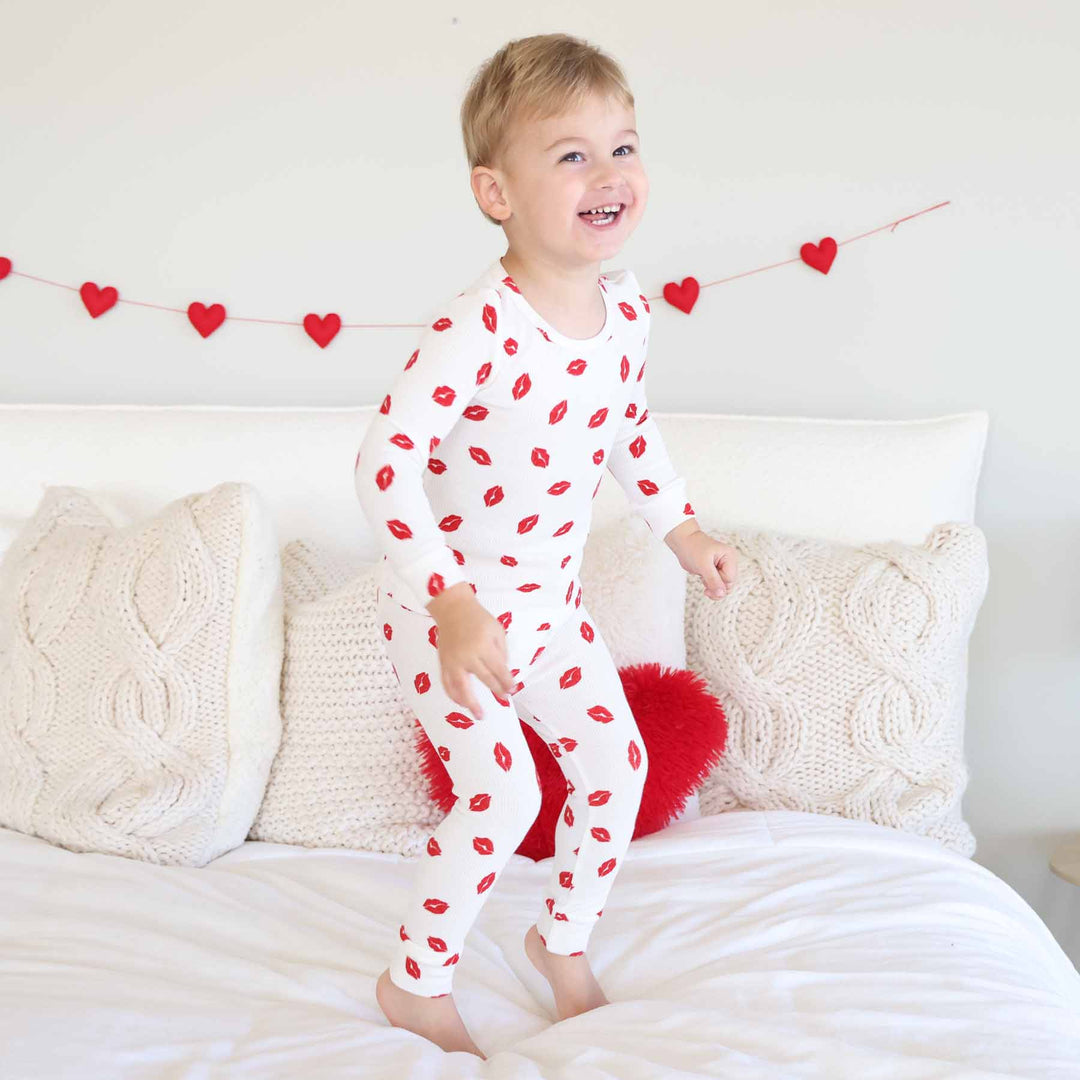 boy jumping on the bed in two piece bamboo waffle pajama set 