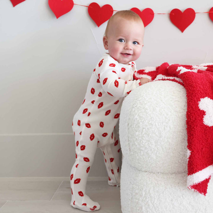 red lipstick kisses long sleeve bamboo waffle zipper footie for baby boys 