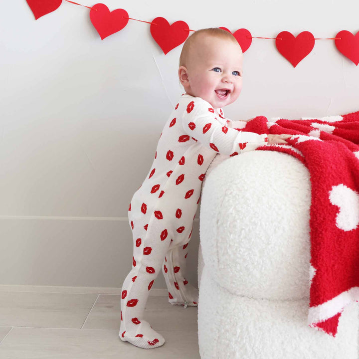 red lip kisses long sleeve bamboo waffle valentine's day footie for babies with foot grips 