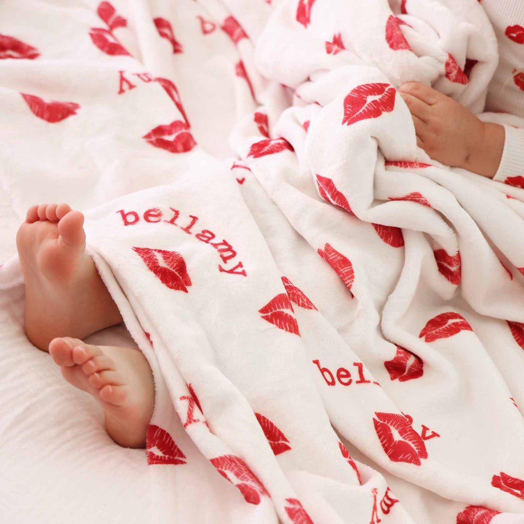 little kisses personalized blanket for kids with red lipstick kisses