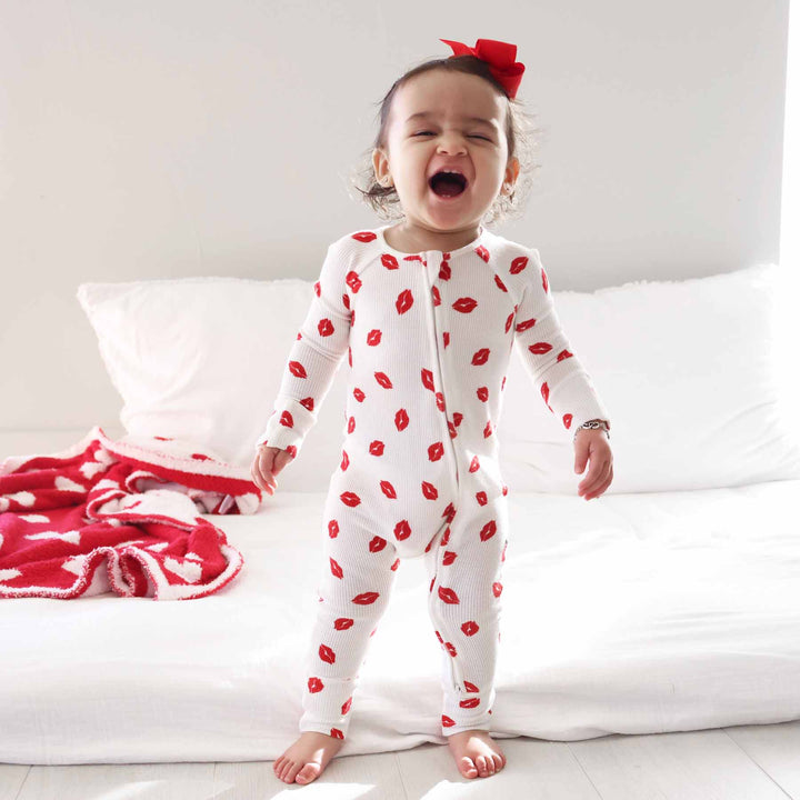 standing baby girl in red lip valentine's day zip romper 