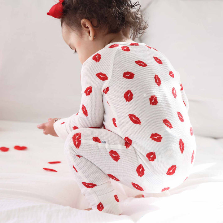 closeup of red lip valentine's day pajama romper 
