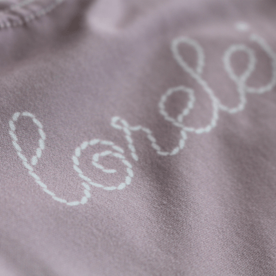 purple knot gown stitched with name 