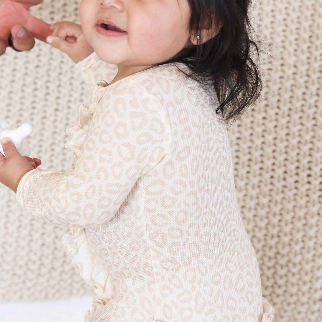 beige leopard bamboo viscose long sleeve baby footie for girls 