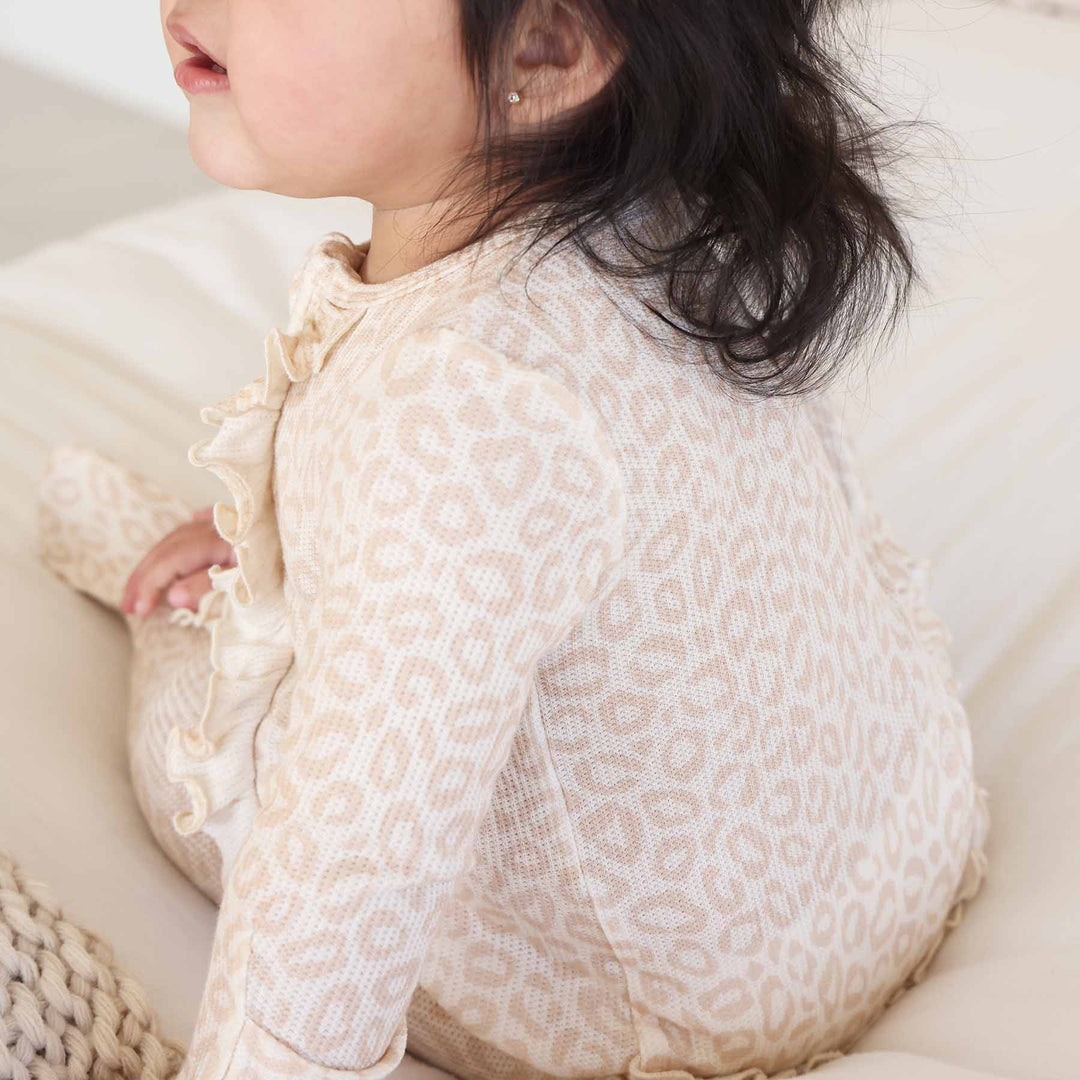 leopard spots ruffle bottom footie baby pj