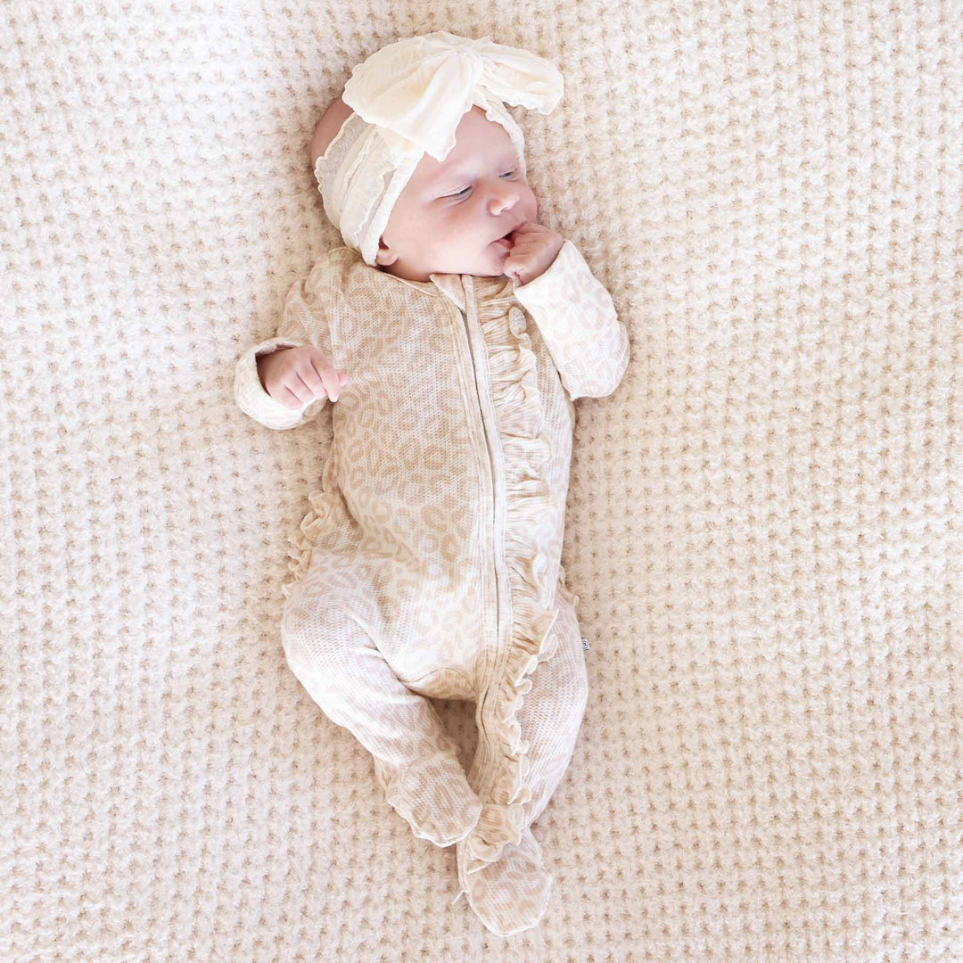 baby girl wearing the lovely leopard footie