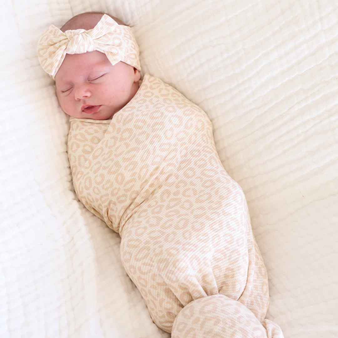 newborn girl oversized stretchy swaddle blanket with a neutral leopard print