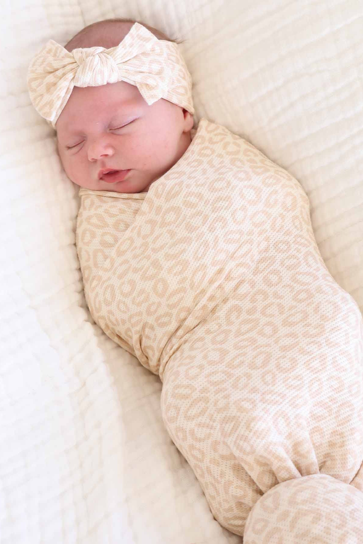 newborn girl oversized stretchy swaddle blanket with a neutral leopard print