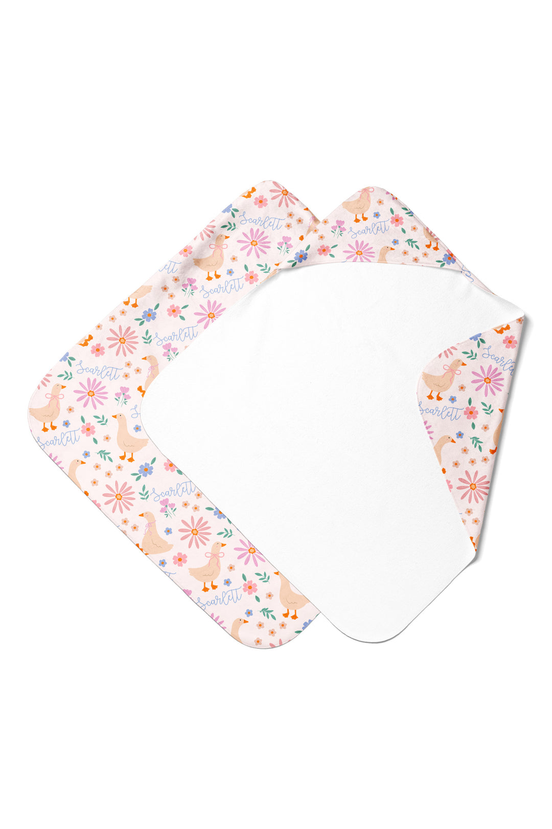 Product mockup showing baby and kids sizes of the Personalized Hooded Towel in the Lucy Goosy duck and floral print, displayed diagonally showing the exterior print and white terry interior