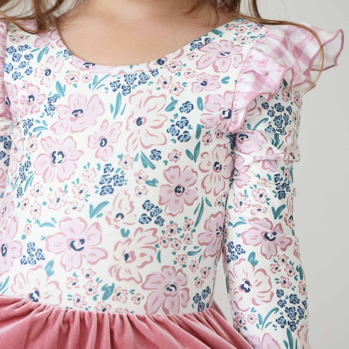 blush, mauve and teal floral long sleeve leotard for girls with pink and white gingham sleeve detailing 