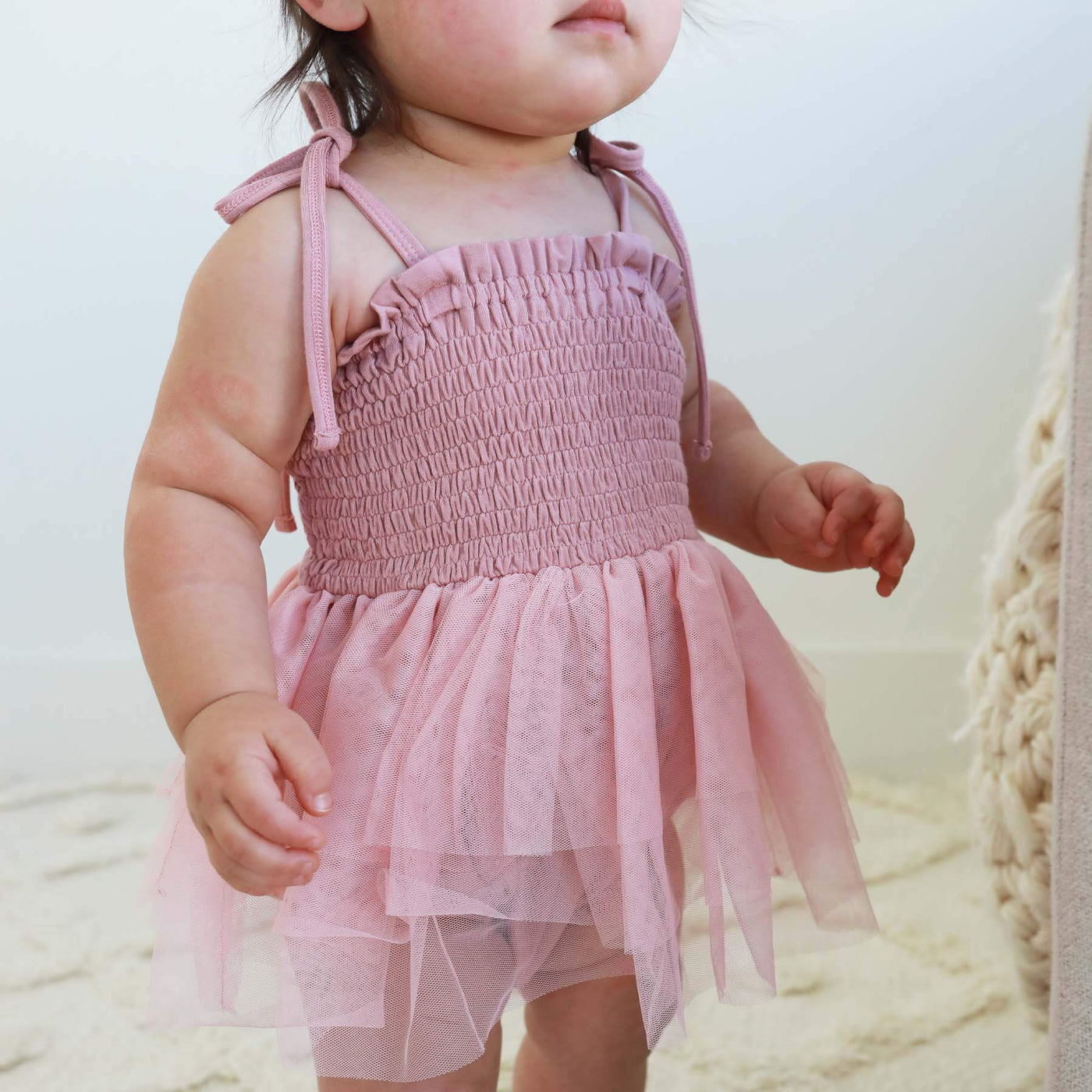 light pink bodysuit for babies with tutu and smoked top 