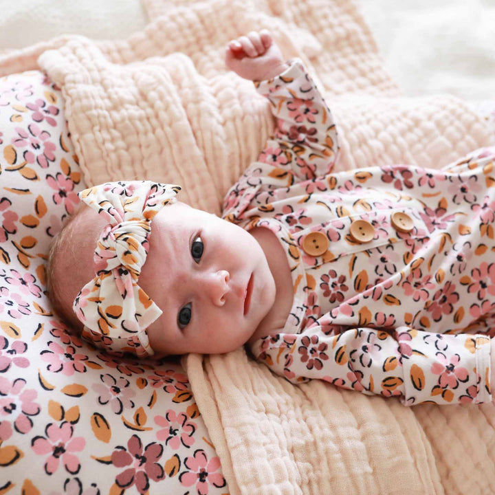 pink and purple floral knot gown for babies 